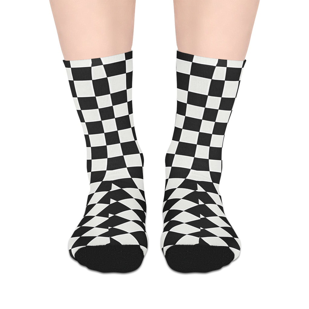 Black and white checkered socks on a plain background