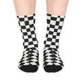 Black and white checkered socks on a plain background