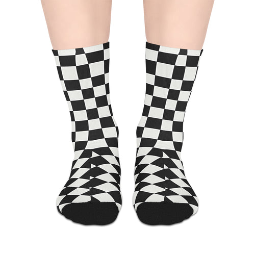 Black and white checkered socks on a plain background