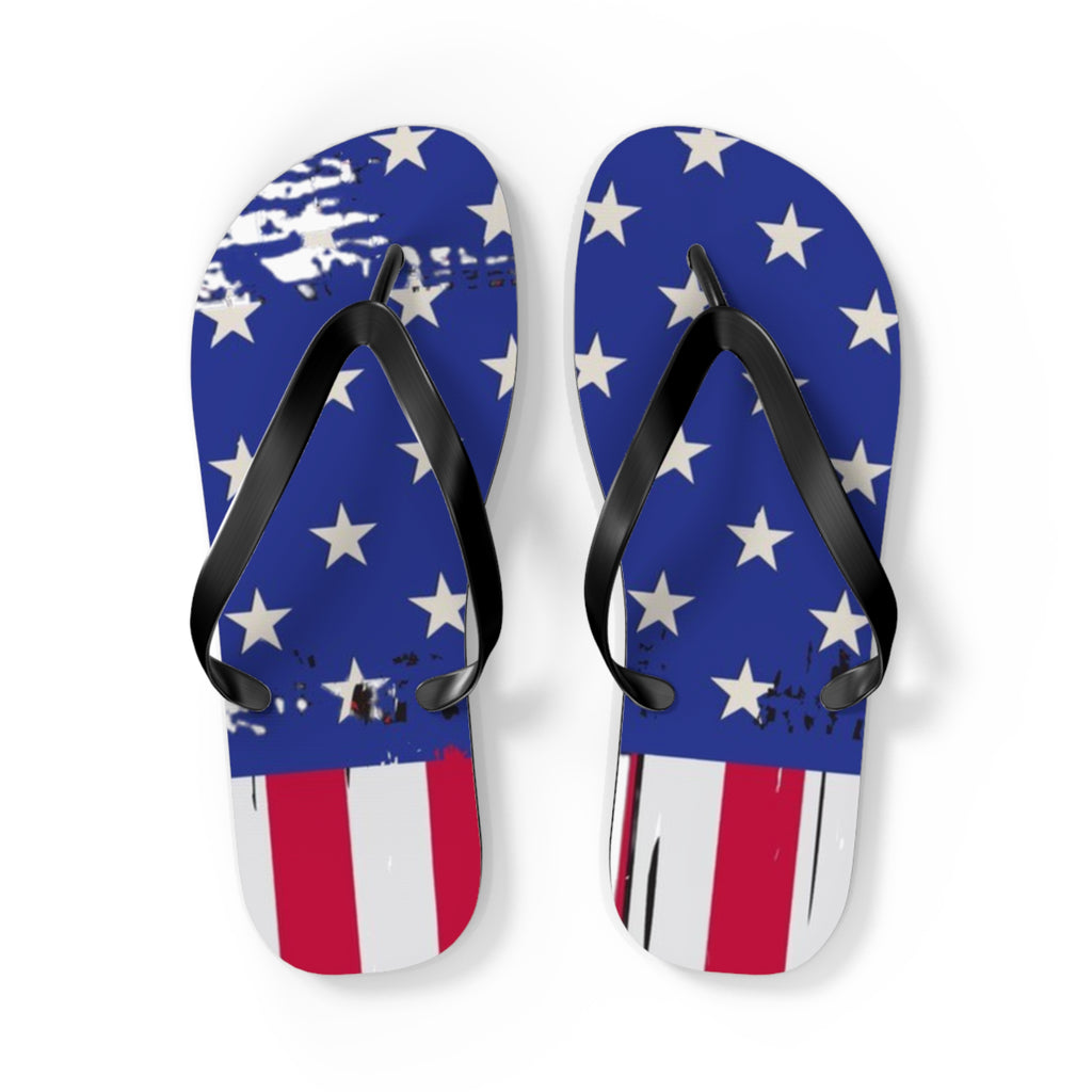A pair of flip-flop sandals with a distressed American flag design, featuring a blue upper with white stars and red and white stripes on the sole, black straps, and a white background.