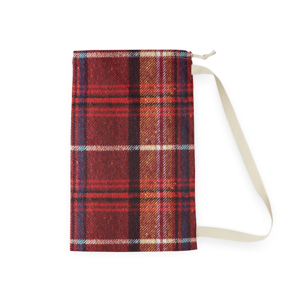 A red and brown plaid fabric pouch with a cream-colored strap, shown against a plain white background.