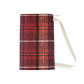 A red and brown plaid fabric pouch with a cream-colored strap, shown against a plain white background.