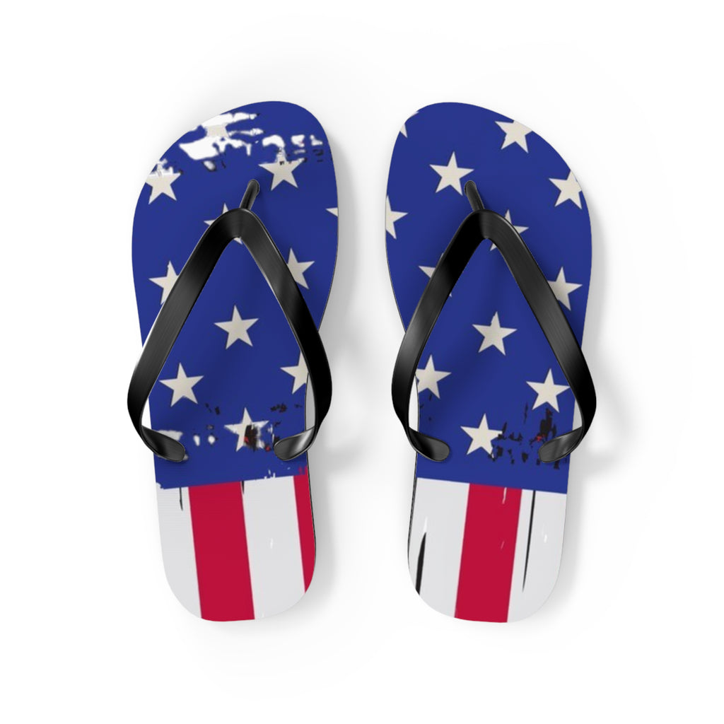 A pair of flip-flop sandals with a distressed American flag design, featuring blue feet with white stars and red and white stripes, and black straps, shown on a white background.