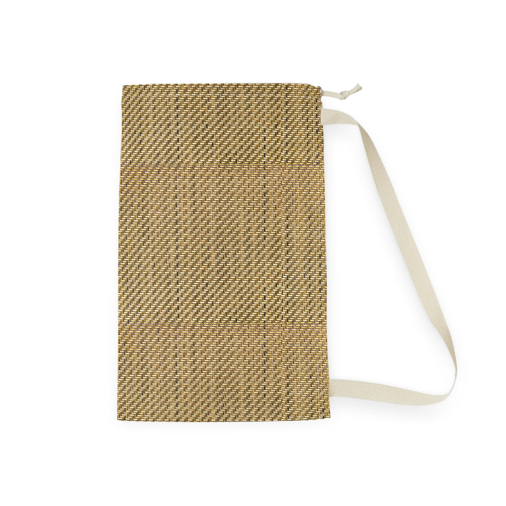 A rectangular woven pouch or notebook cover in a tan and brown textured pattern, featuring a cream-colored fabric strap and zipper pull, shown on a plain white background.