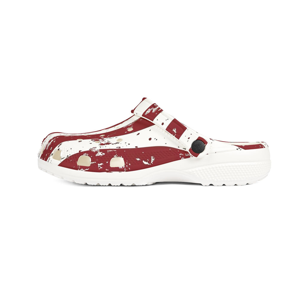 White clog with red splatter design on a white background