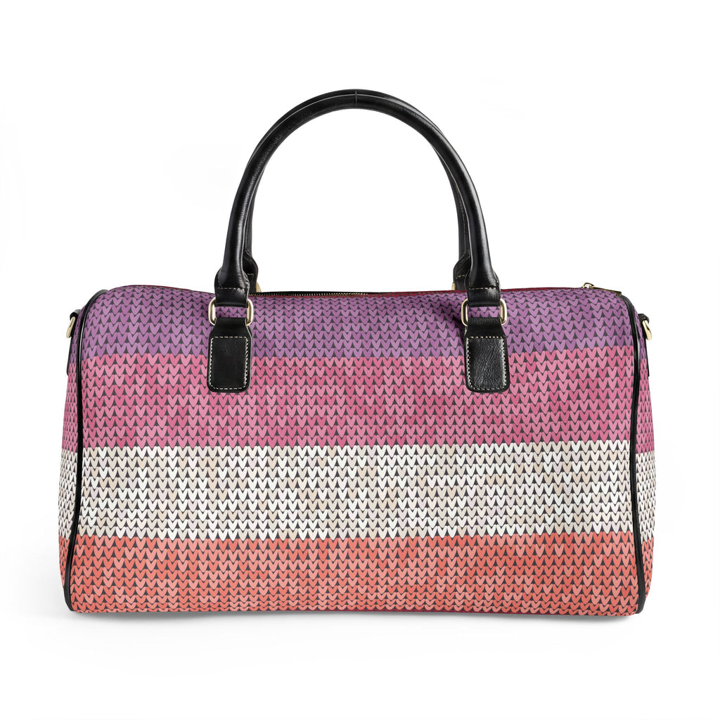 A woven duffle bag with horizontal stripes in purple, pink, white, and coral, featuring black leather top handles and gold-tone hardware, shown against a plain white background.