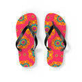 Colorful flip-flops with floral pattern on a pink background