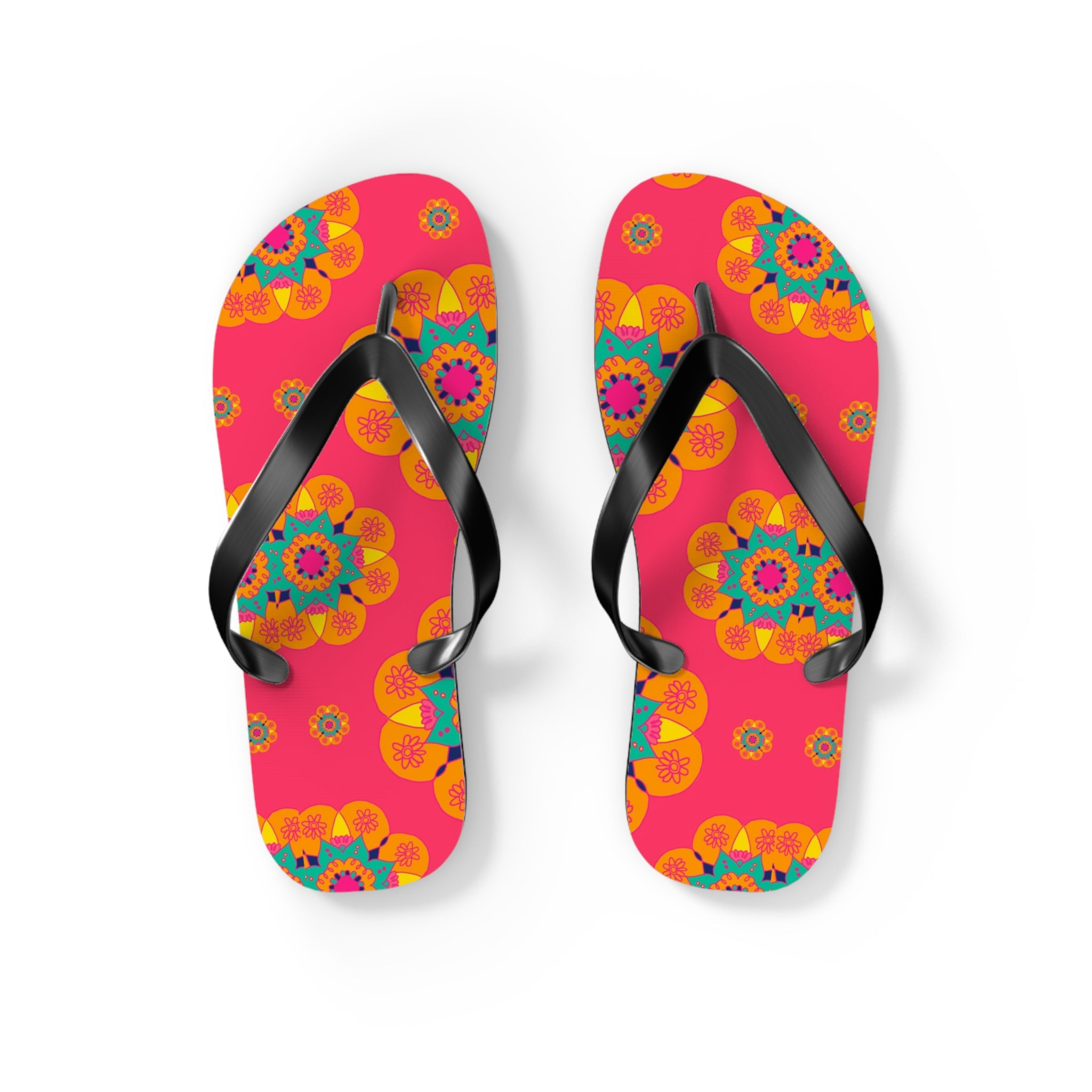Colorful flip-flops with floral pattern on a pink background