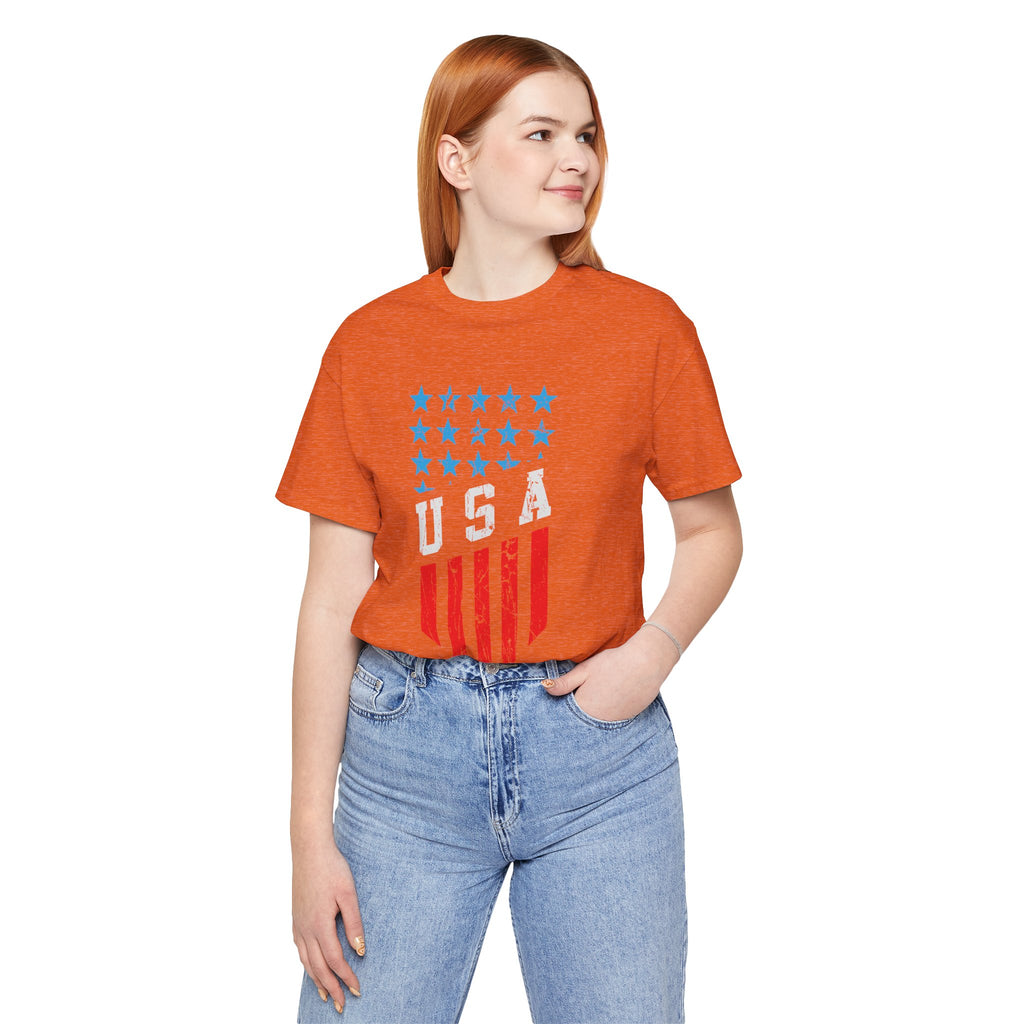 Person wearing an orange t-shirt with a USA graphic design on a white background