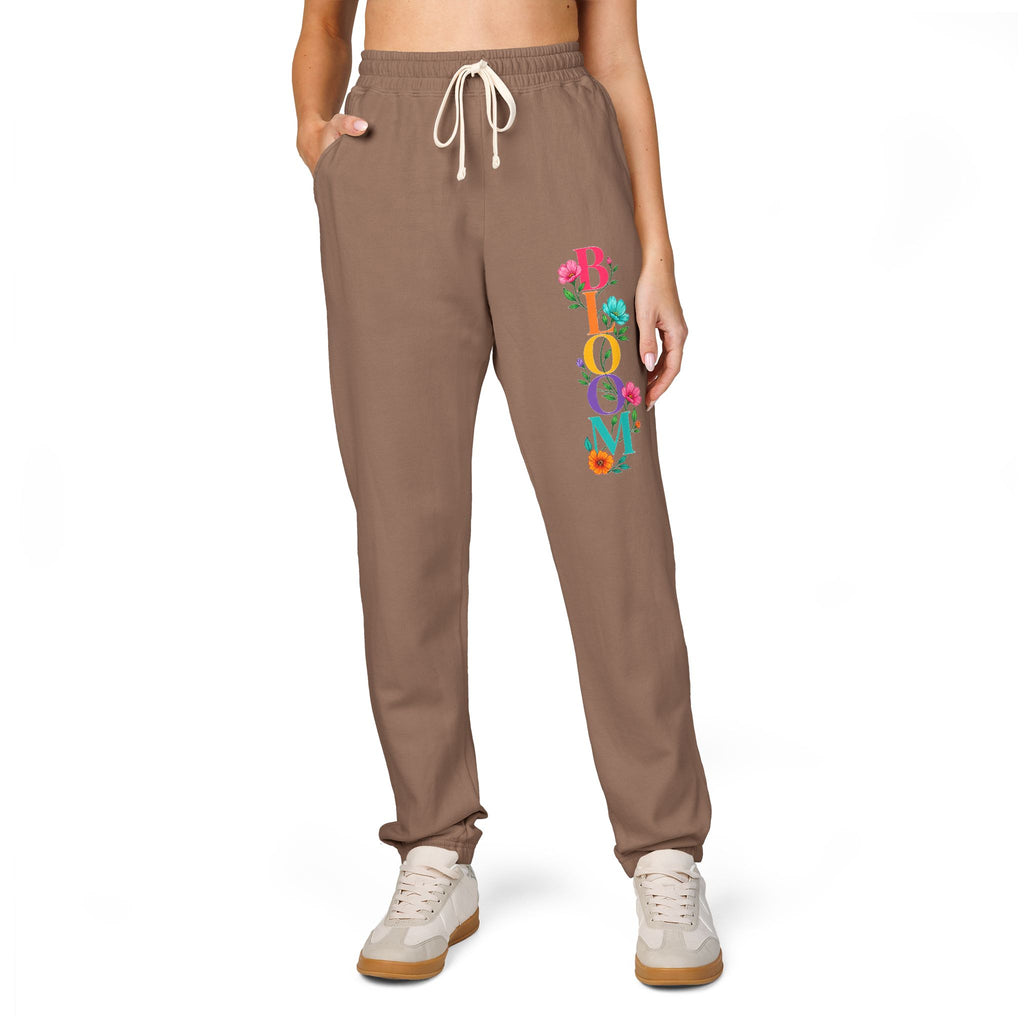 Brown sweatpants with colorful text on a white background