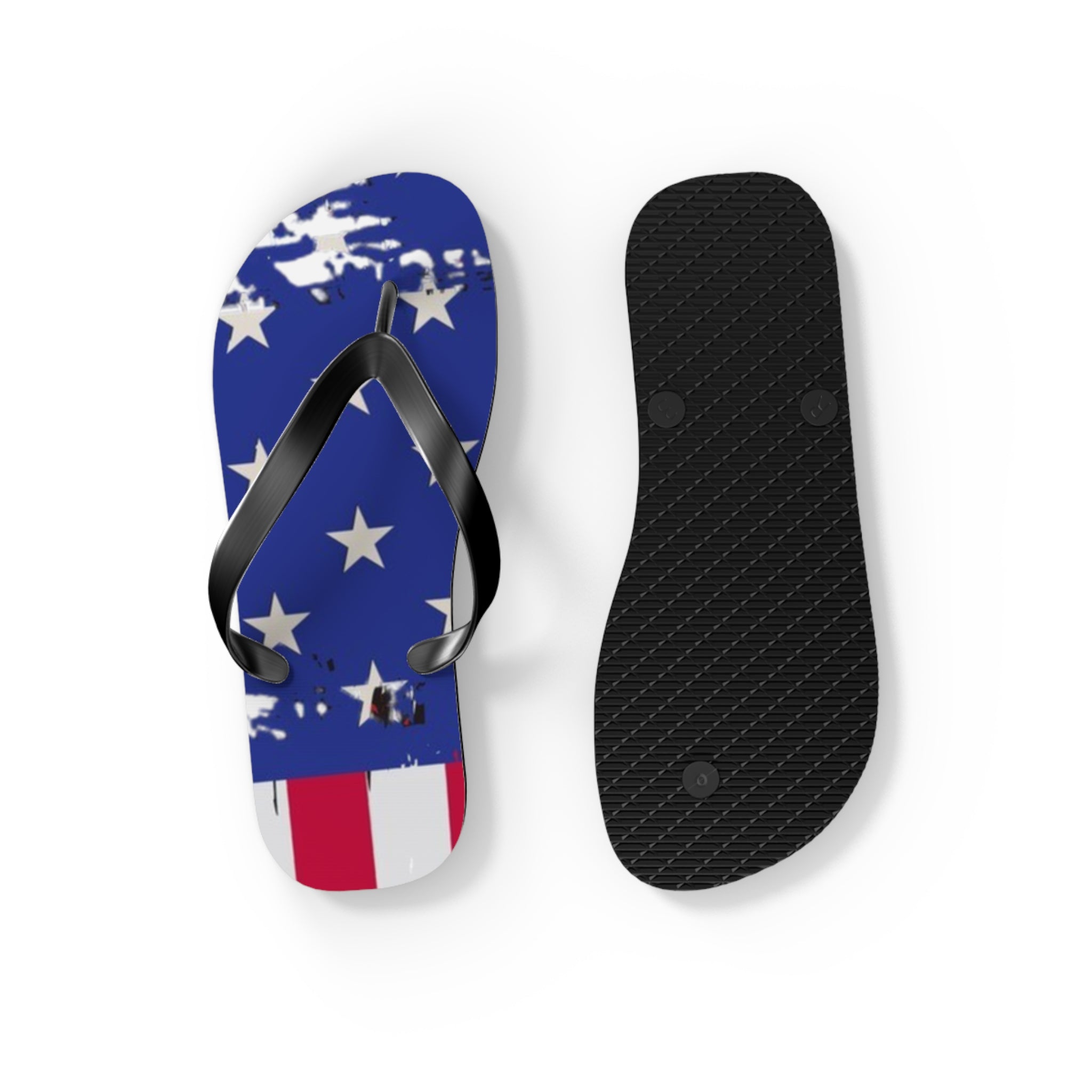 A pair of flip-flop sandals shown from the top and bottom on a white background. The top features a distressed American flag design with white stars on a blue background and red and white stripes at the bottom.