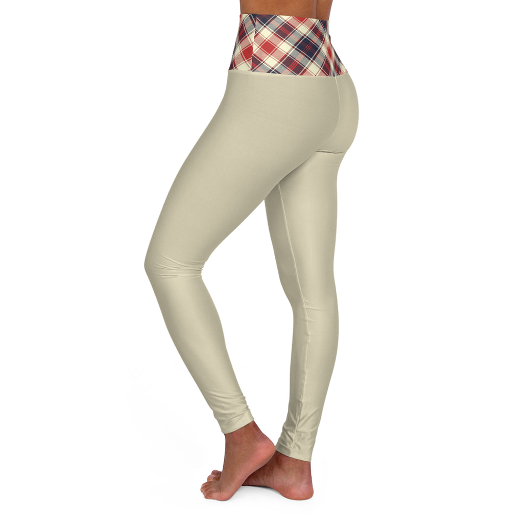 Beige high-waisted leggings with a red, navy, and white plaid waistband, shown on a model from the side against a white background.
