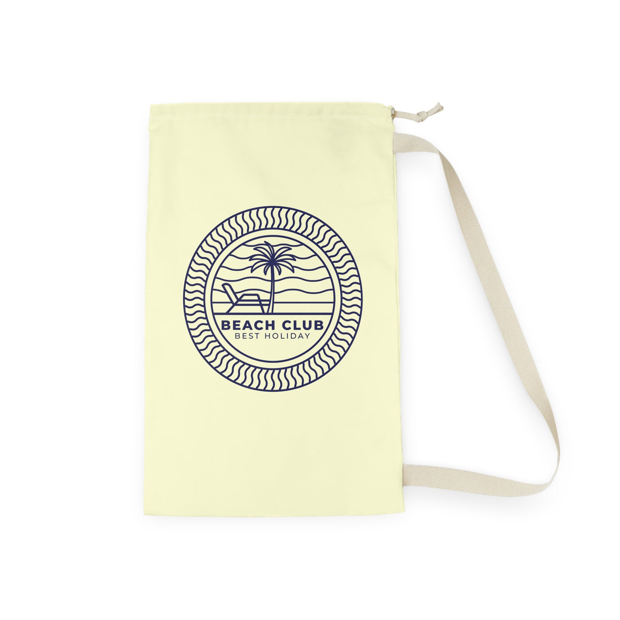 A pale yellow canvas drawstring bag with a navy blue circular graphic that reads 'BEACH CLUB EST. HOLIDAY' with a palm tree and lounge chair illustration.