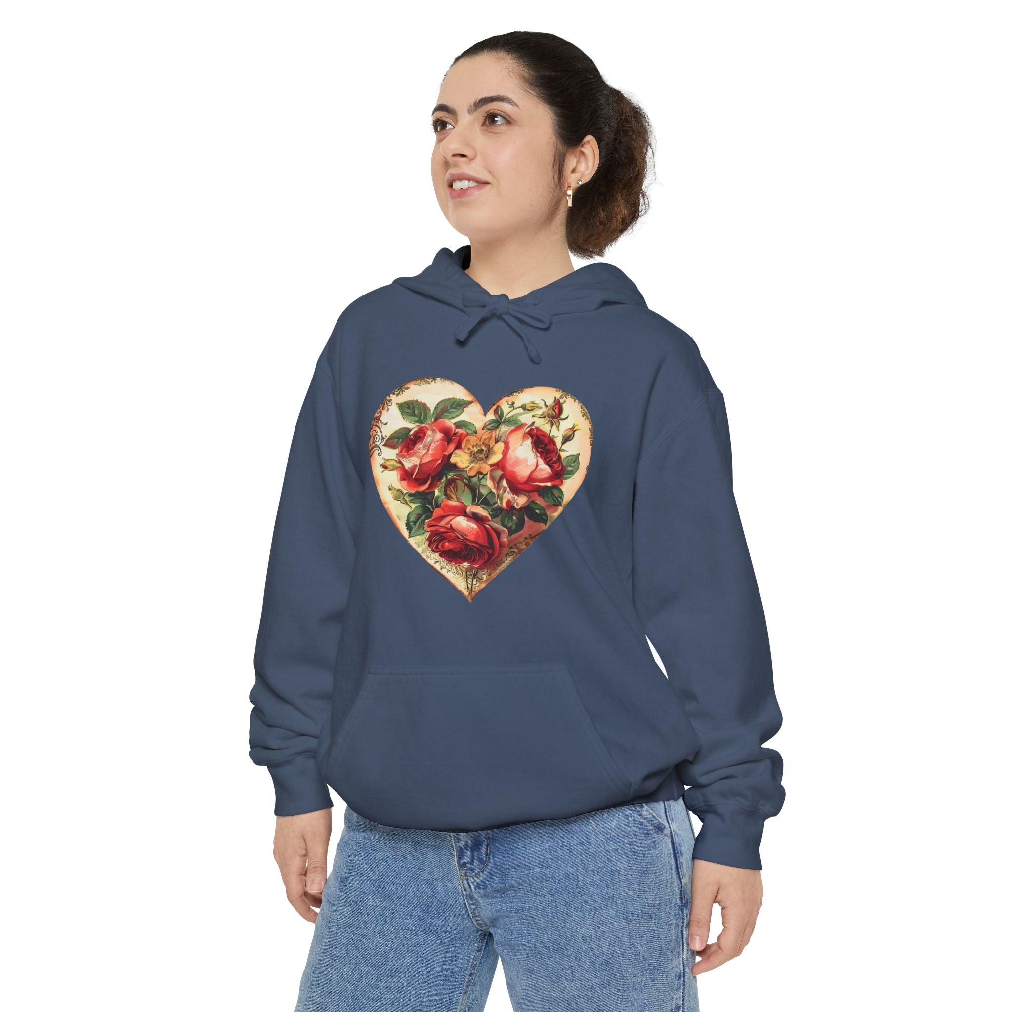 Person wearing a navy blue hoodie with a floral heart design on a white background