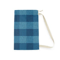 A blue plaid drawstring pouch with a cream-colored strap, shown flat against a white background.