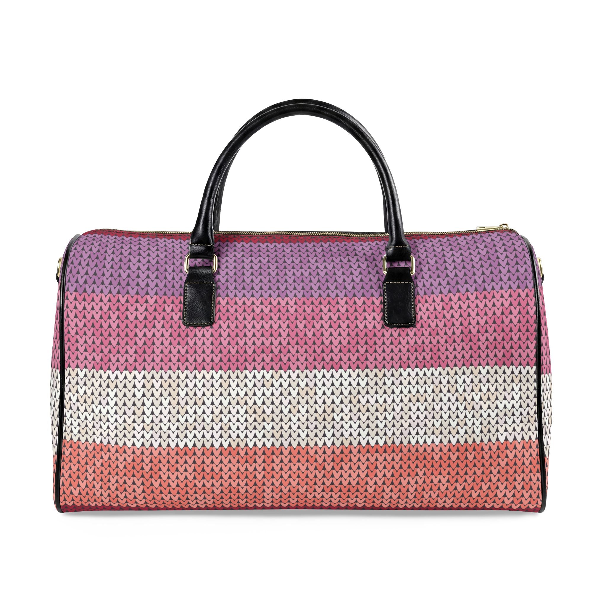 A woven duffle bag with horizontal stripes in purple, pink, and white, featuring black leather top handles and gold-tone hardware, shown against a plain white background.