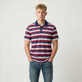 Man wearing a striped polo shirt with a plain background