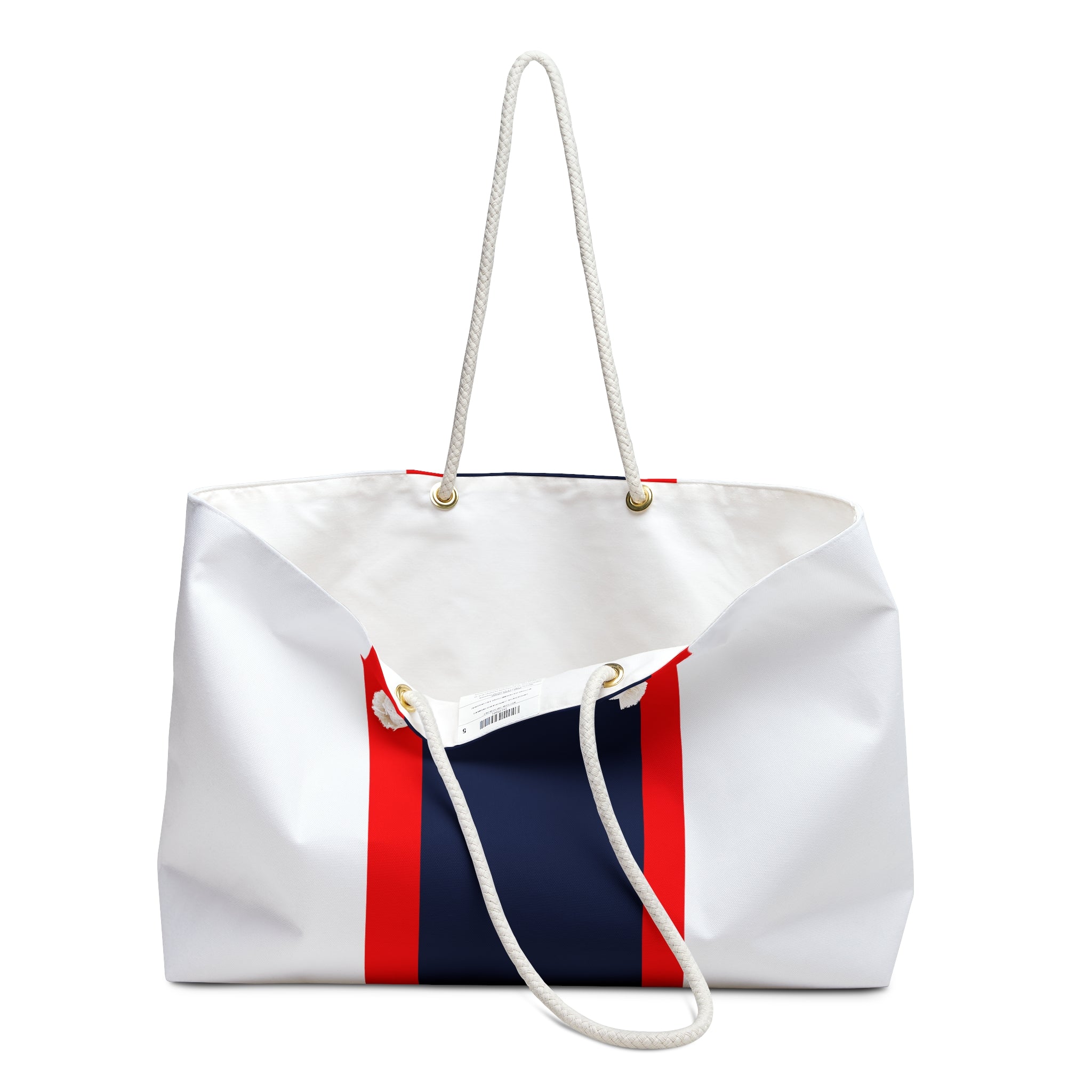 A white canvas tote bag with a navy blue center panel and red side stripes, featuring white rope handles and gold-tone hardware, shown on a plain white background.