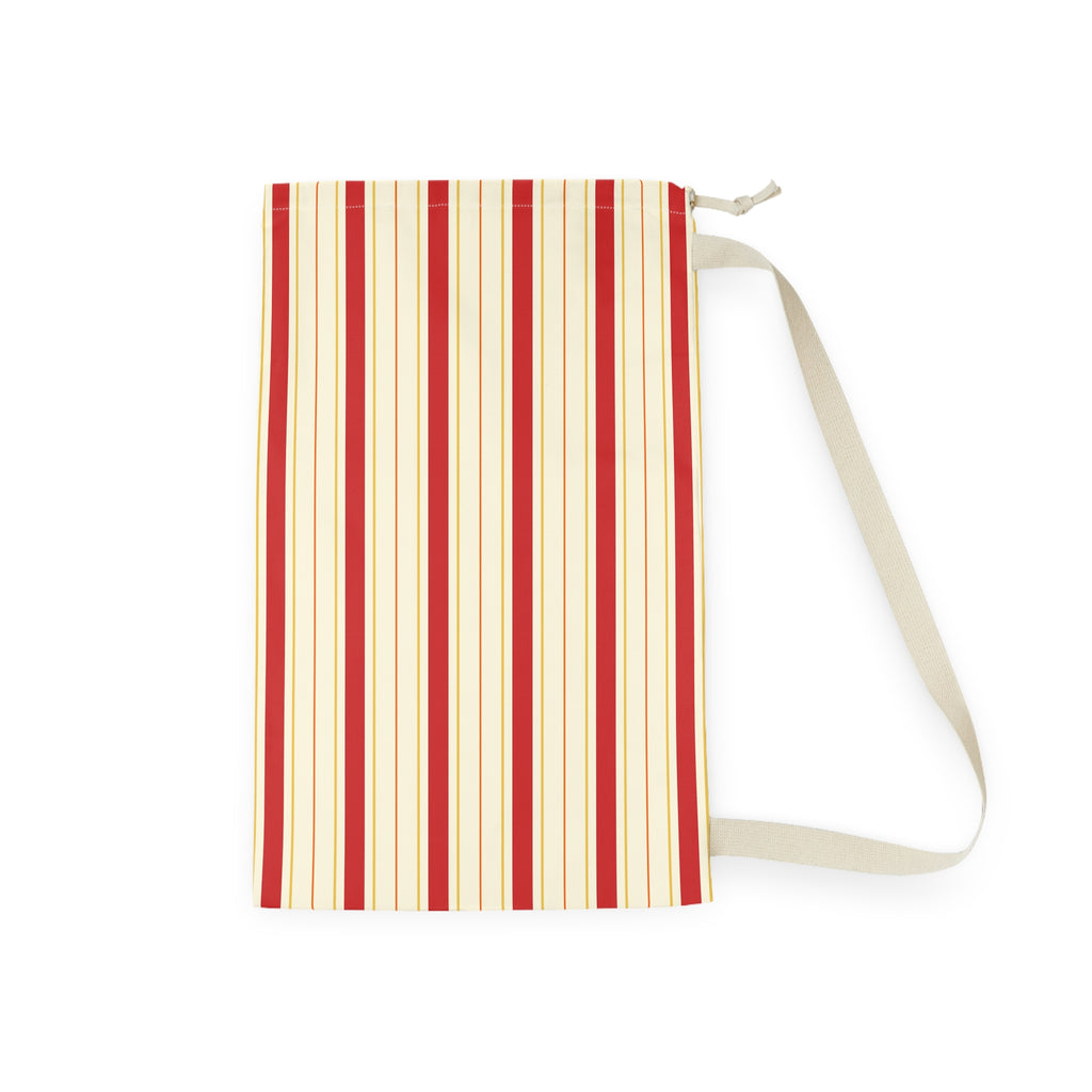 A vertical zippered pouch with a cream and red striped pattern, featuring a matching cream shoulder strap, shown on a plain white background.