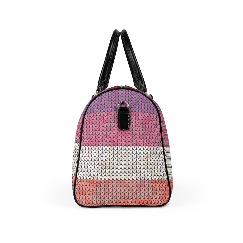 A dome-shaped handbag with a textured knit pattern featuring horizontal stripes of purple, pink, white, and coral pink, finished with black leather handles and trim.