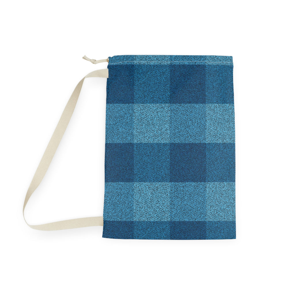 A fabric drawstring pouch with a blue plaid pattern and a cream-colored strap, shown on a plain white background.