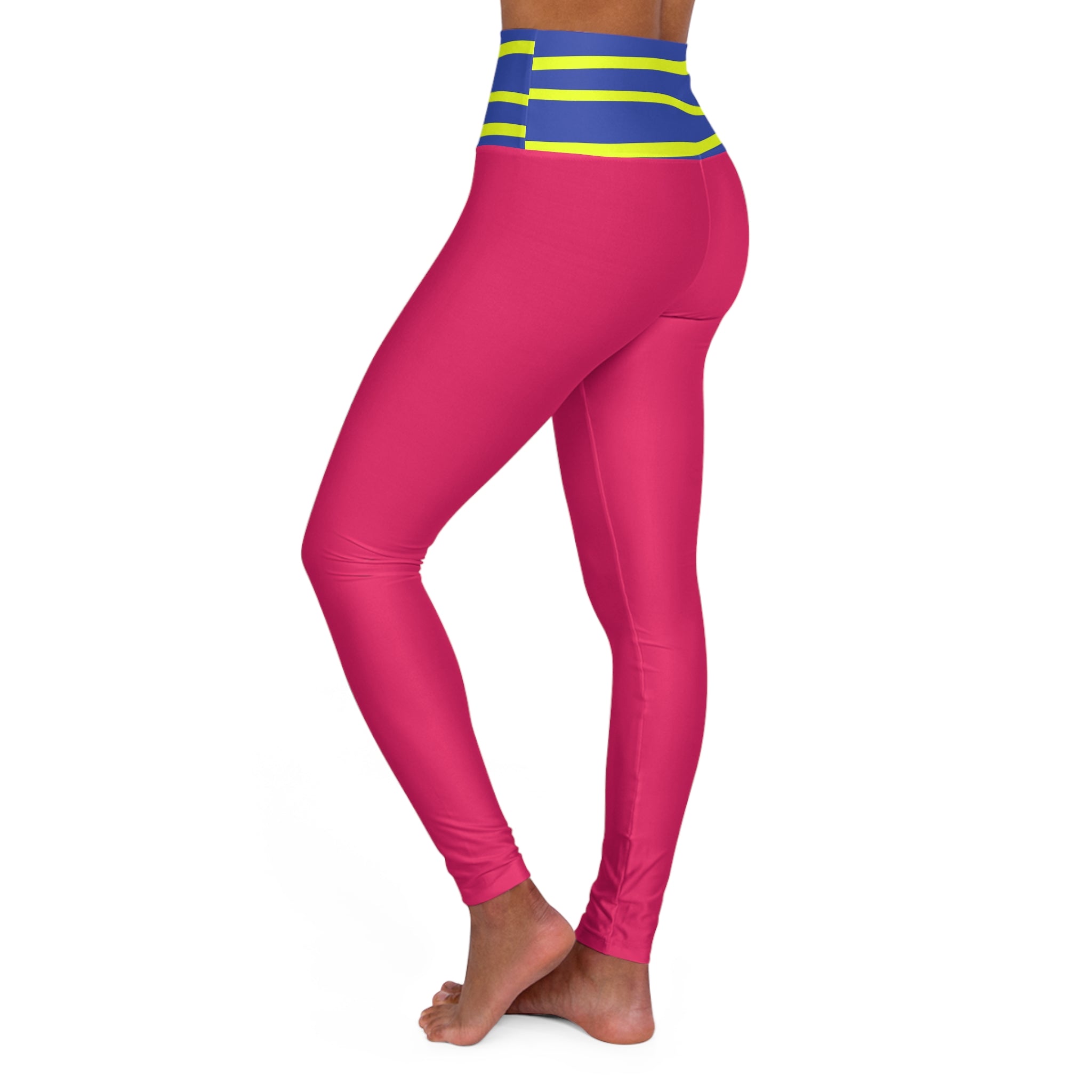 A person wearing bright pink full-length leggings with a blue and neon yellow striped waistband, shown from the side against a plain white background.