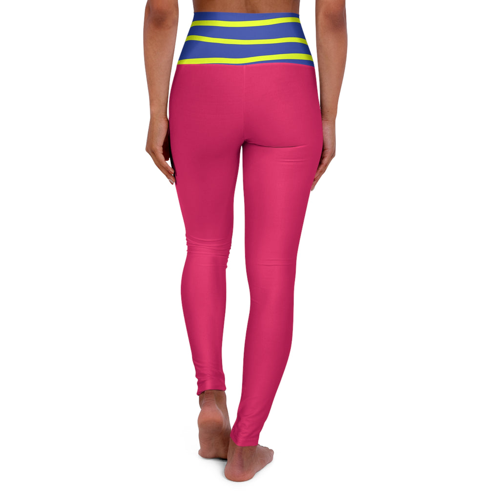 A person shown from the back wearing bright pink leggings with a blue and yellow striped waistband, standing barefoot against a plain white background.