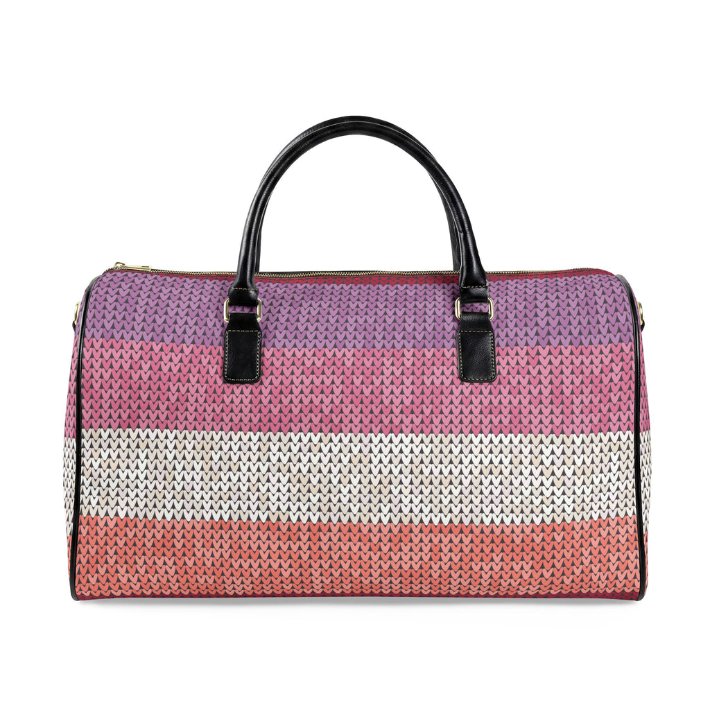A woven duffle bag with horizontal stripes in purple, pink, white, and coral, featuring black leather top handles and gold-tone hardware, shown against a plain white background.