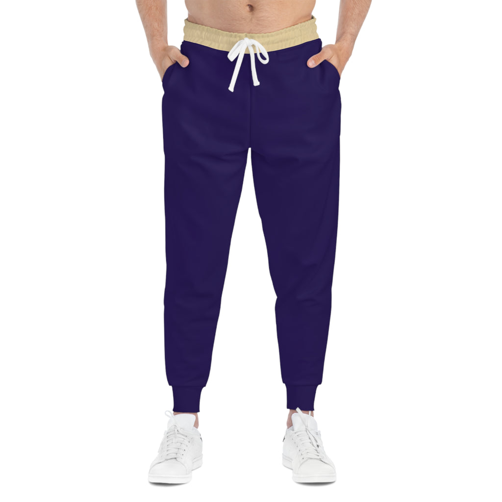 Person wearing patterned jogger pants with a white background
