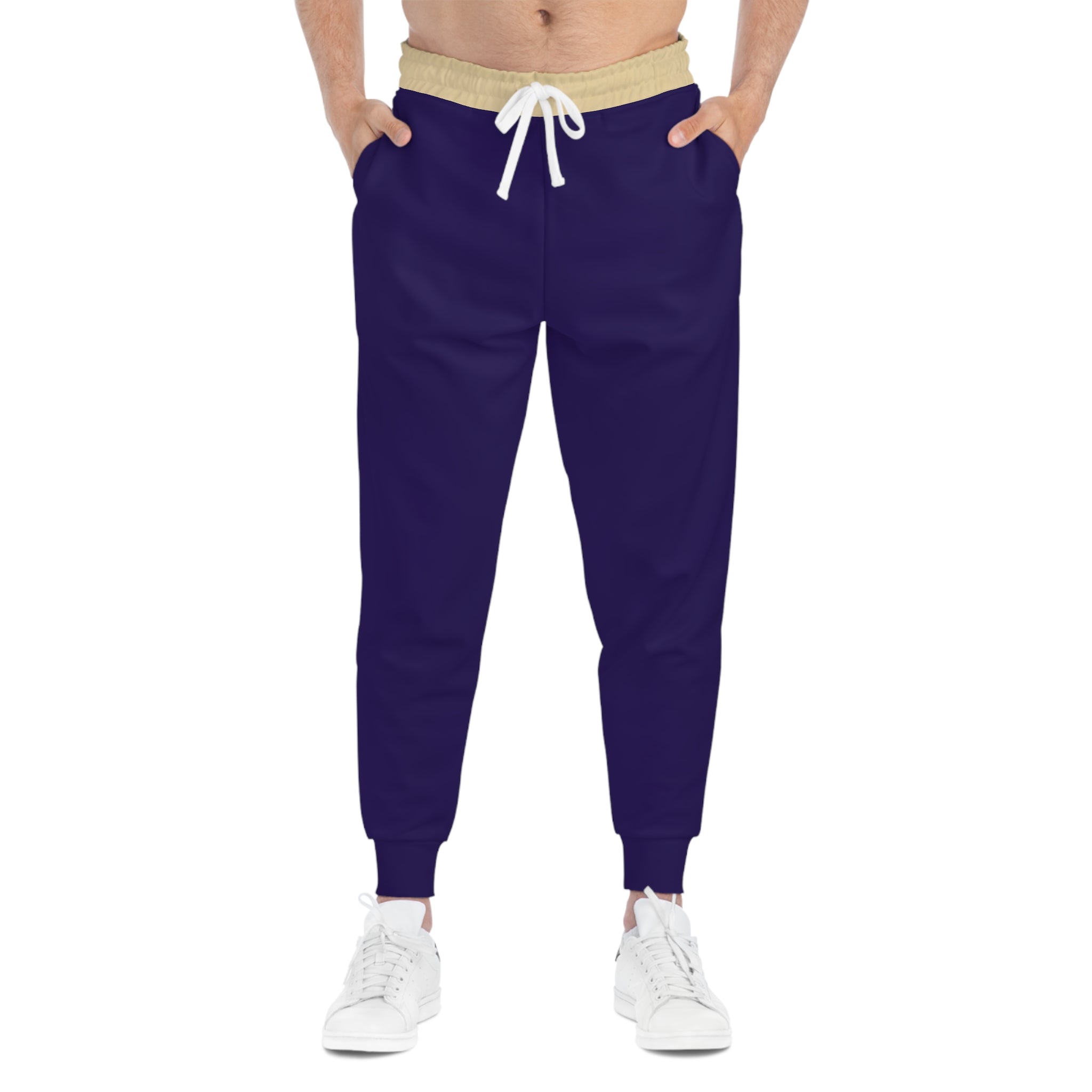 Person wearing patterned jogger pants with a white background