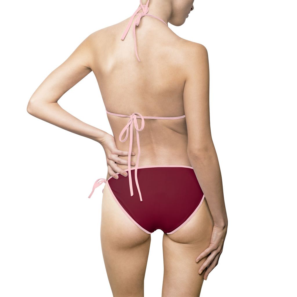 A model shown from the back wearing a string bikini. The bottom is a deep burgundy red with light pink trim and tie, while the top is light pink.