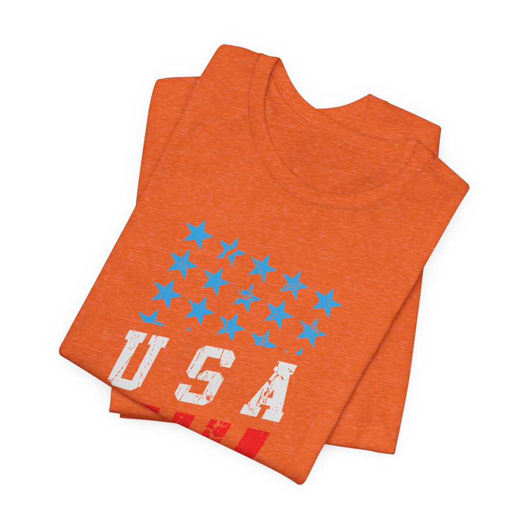 Orange t-shirt with blue stars and 'USA' printed on it, folded and displayed against a white background.