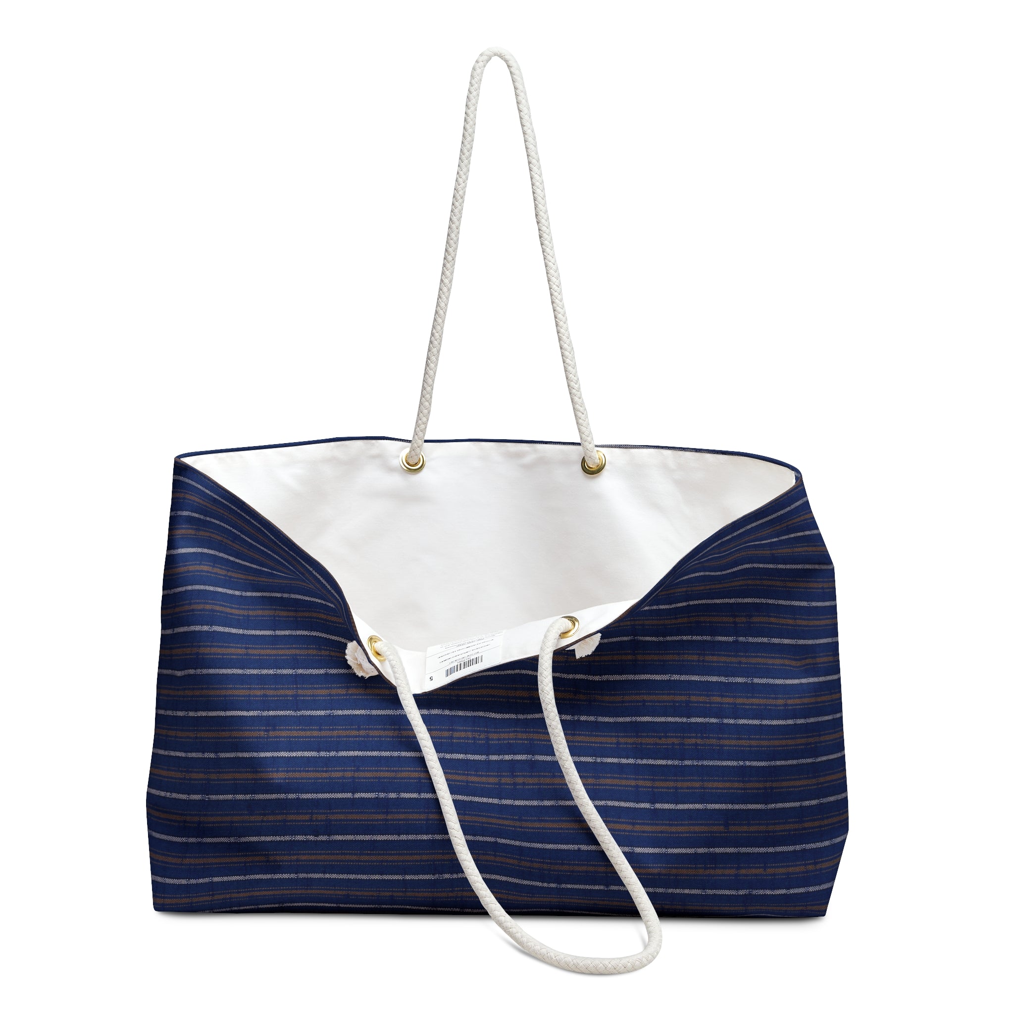 A navy blue canvas tote bag with thin gold stripes, featuring a white rope handle and a white canvas interior, shown against a plain white background.