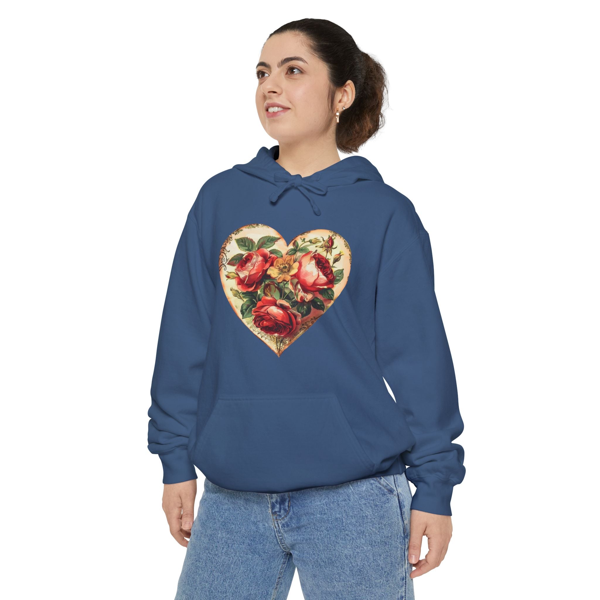 Person wearing a blue hoodie with a floral heart design on a white background