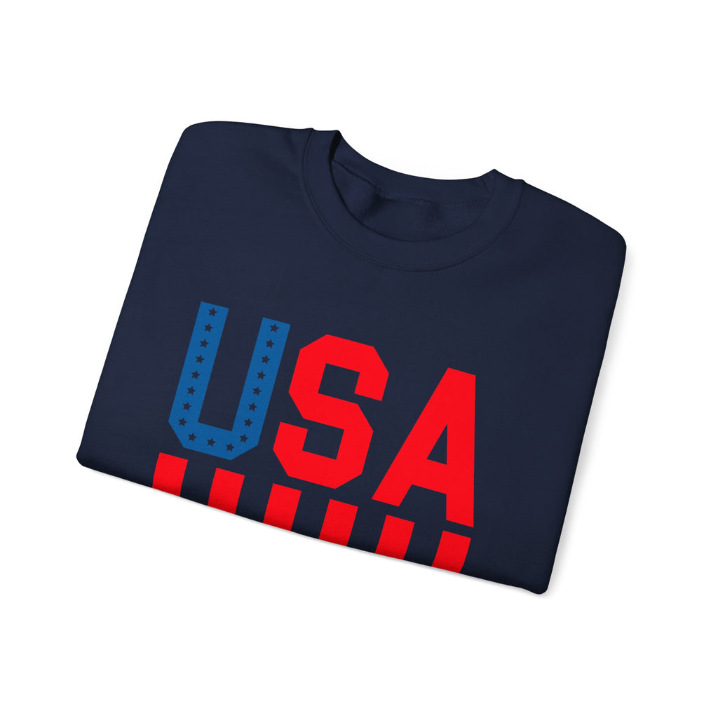 A folded navy blue crewneck t-shirt featuring a bold 'USA' graphic on the front, with 'U' in blue and 'SA' in red, accented by red stripes underneath, shown on a plain white background.