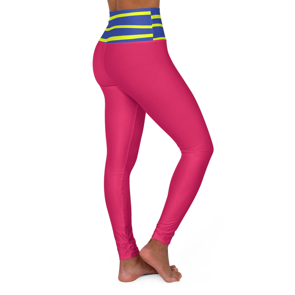 A person modeling high-waisted leggings against a plain white background, shown from the waist down. The leggings are bright pink with a wide waistband featuring blue and neon yellow-green horizontal stripes.