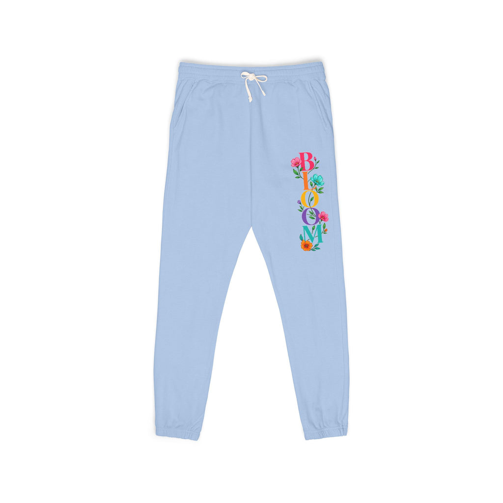 Light blue sweatpants with colorful design on a white background