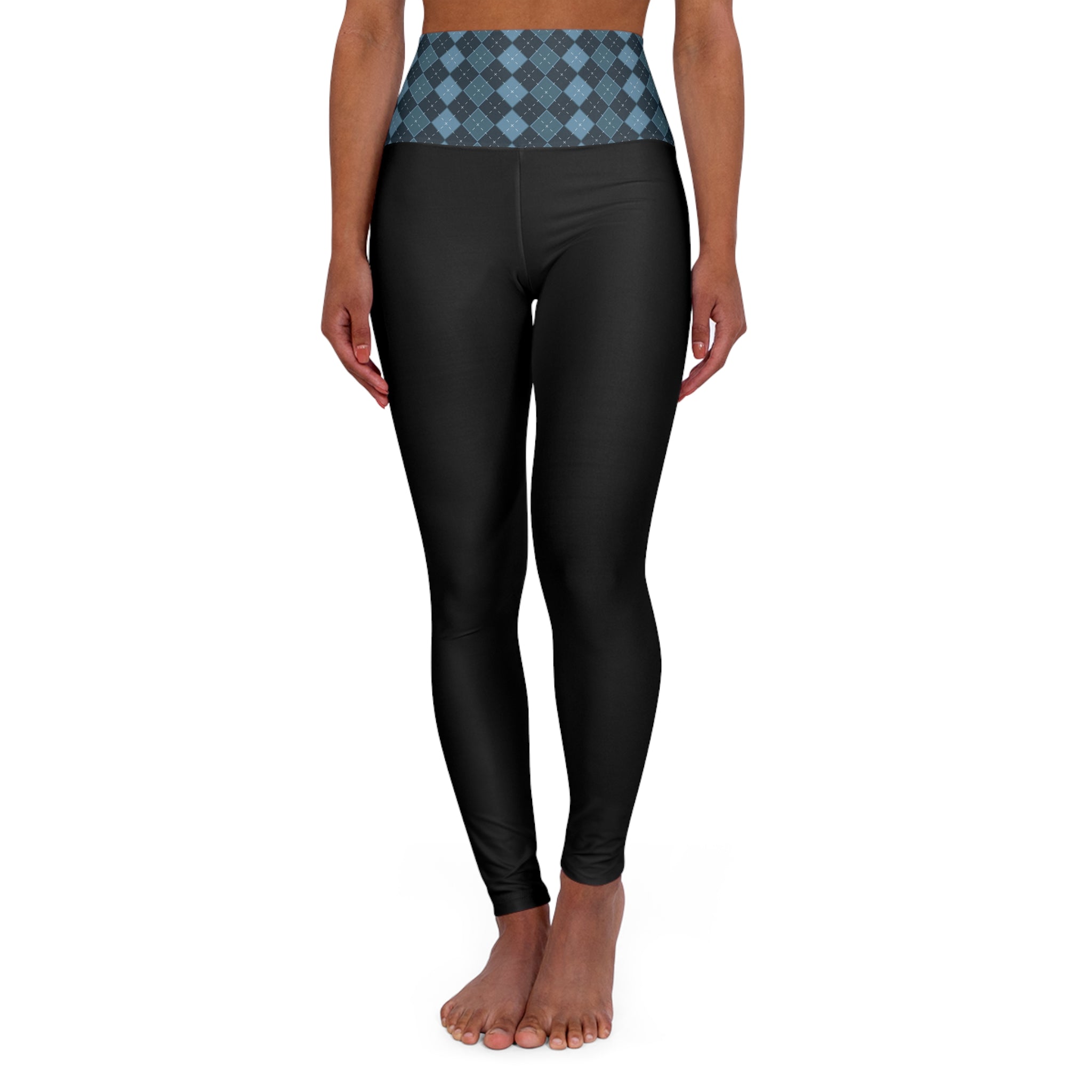 A model wearing high-waisted black leggings with a blue and gray argyle patterned waistband, shown against a plain white background.