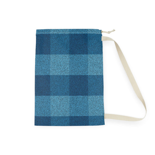 A fabric drawstring pouch featuring a blue and navy buffalo plaid pattern, with a beige strap and zipper pull, shown on a plain white background.