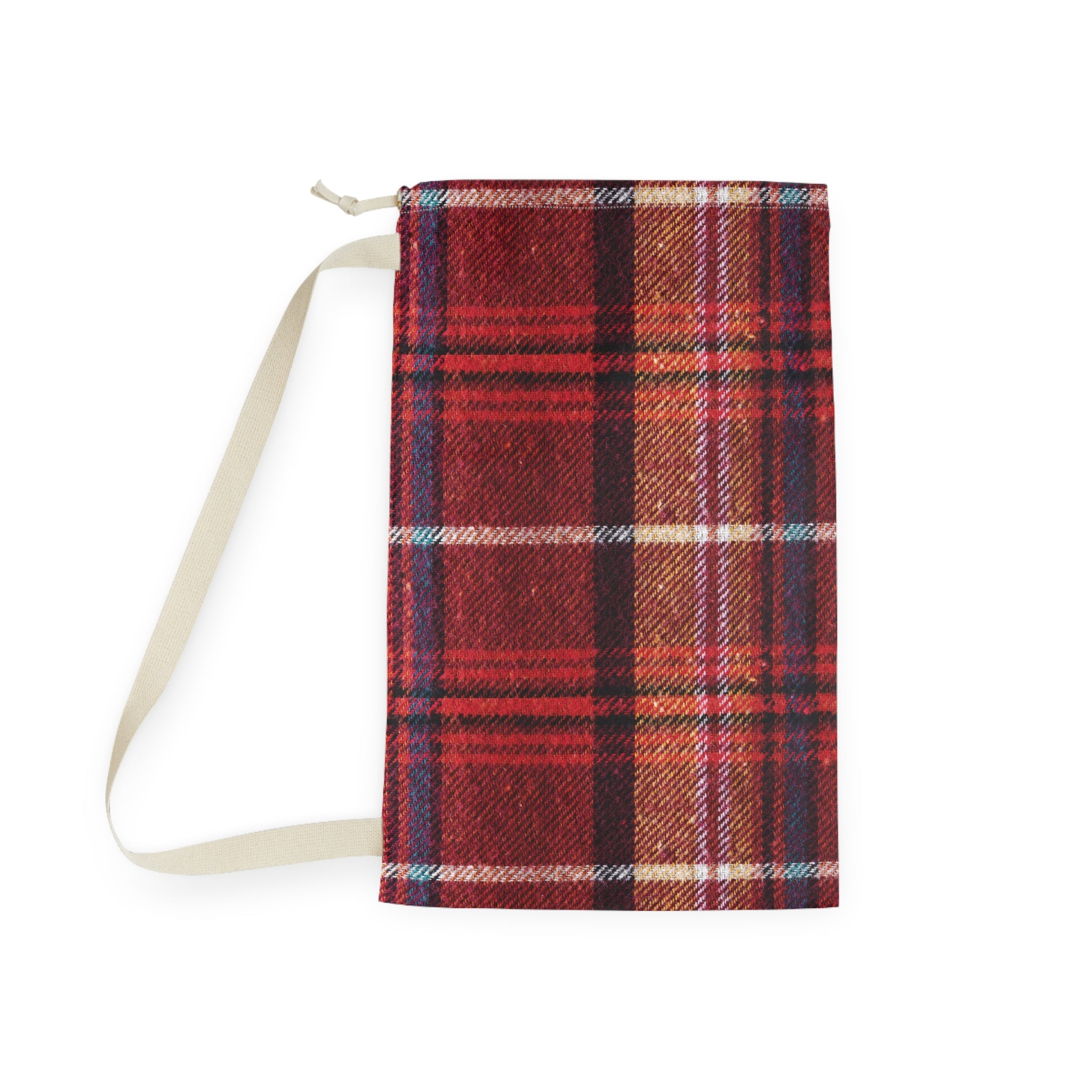 A small zippered fabric pouch or notebook cover in a red and brown plaid pattern, featuring a light beige strap, shown against a plain white background.