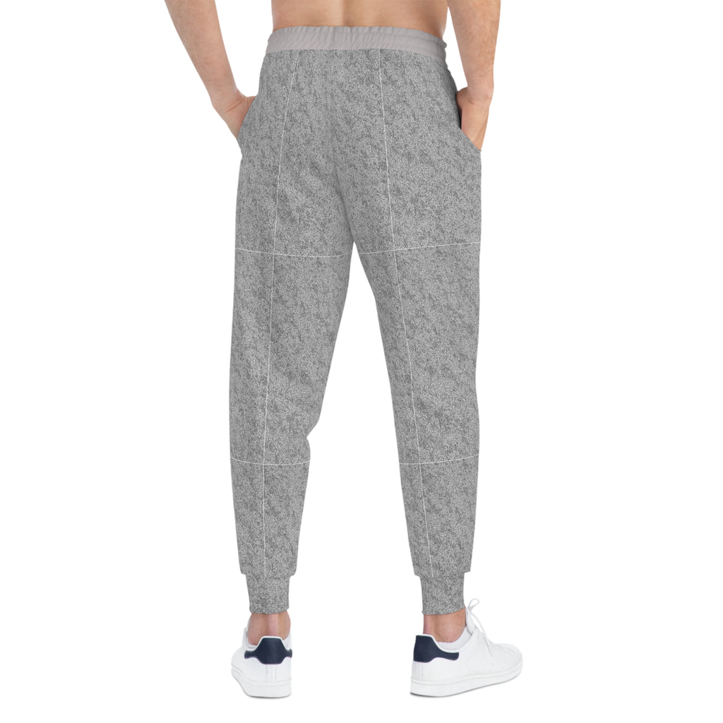 A person shown from the back wearing heather gray jogger-style pants with a subtle grid pattern, paired with white sneakers, on a plain white background.