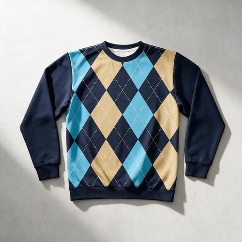 A crewneck sweatshirt featuring an argyle pattern with navy blue, light blue, and tan diamonds, with solid navy sleeves and ribbed cuffs, collar, and hem, laid flat on a textured light gray background.