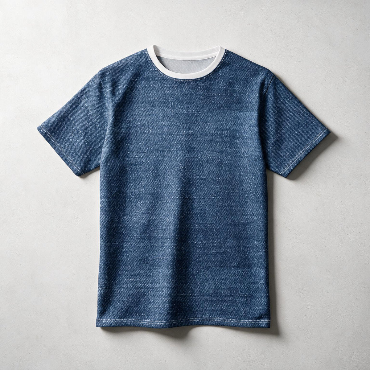 A short-sleeve crewneck t-shirt in a textured blue fabric with a contrasting white ribbed collar, laid flat on a light gray background.