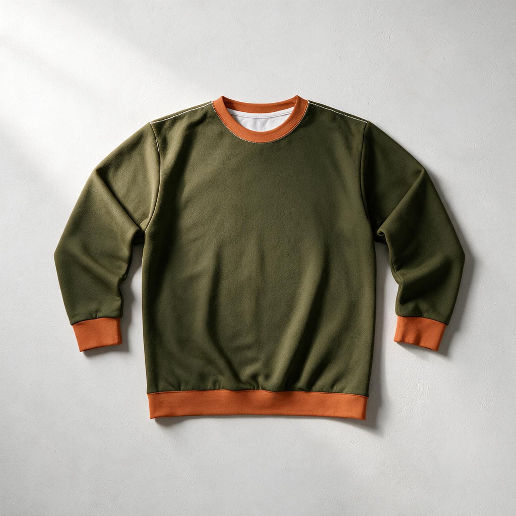 An olive green crewneck sweatshirt with contrasting orange ribbed trim on the collar, cuffs, and hem, laid flat on a light gray background.