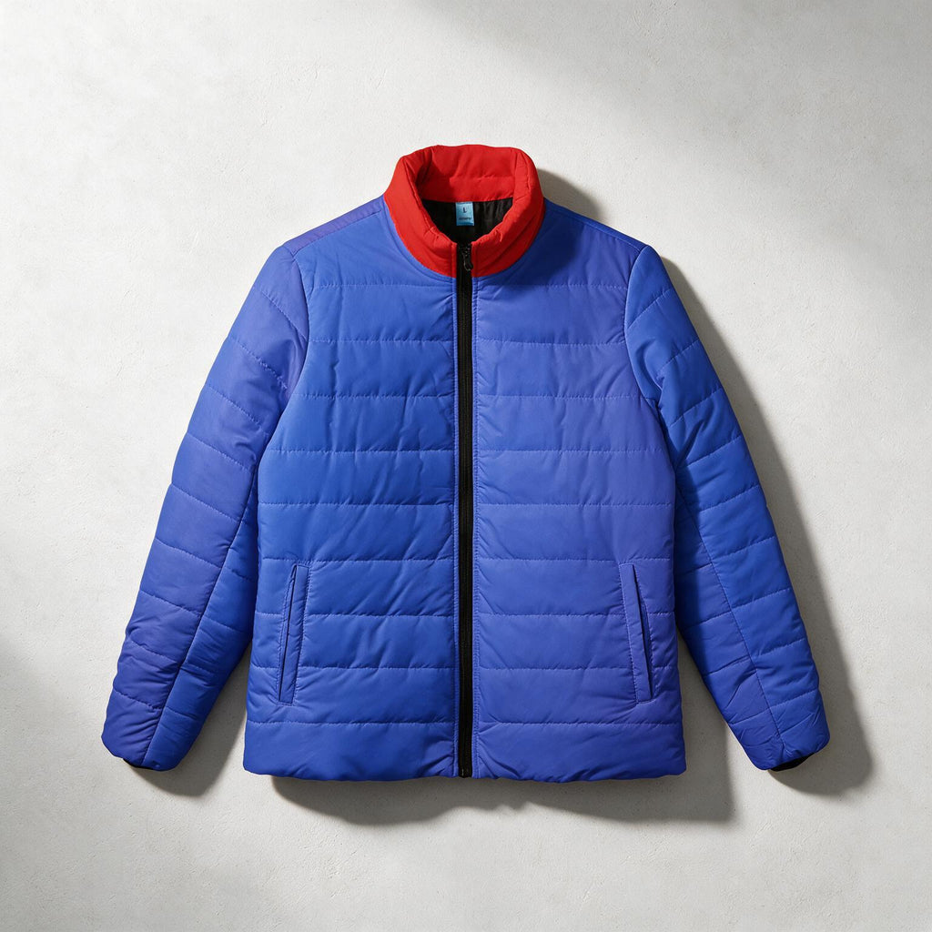 A blue puffer jacket with a bright red collar, shown flat against a light gray textured background.
