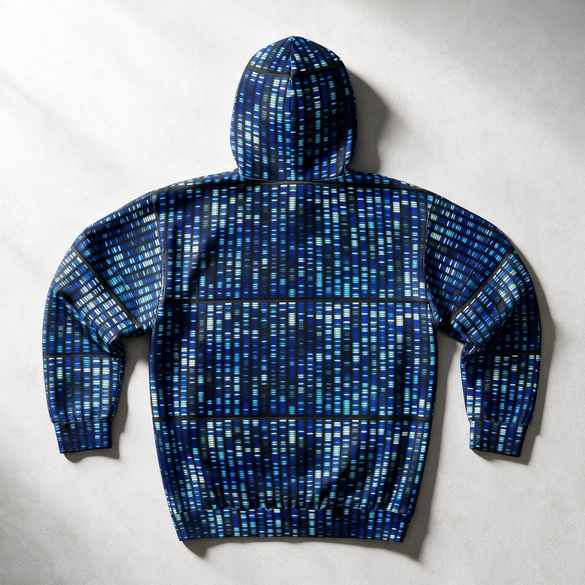 A blue zip-up hoodie with a digital grid pattern in shades of blue and black, shown from the back on a light gray textured background.