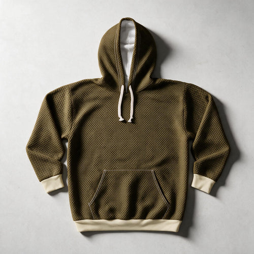 An olive green textured pullover hoodie with a white-lined hood, white drawstrings, and contrasting cream cuffs and hem, laid flat on a light gray background.