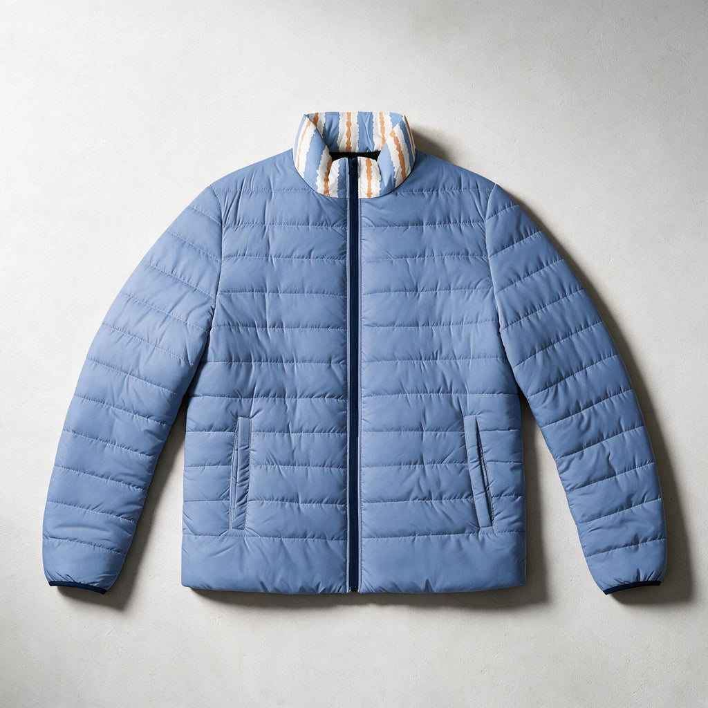 A light blue puffer jacket with a striped collar in blue, white, and orange, laid flat on a light gray background.