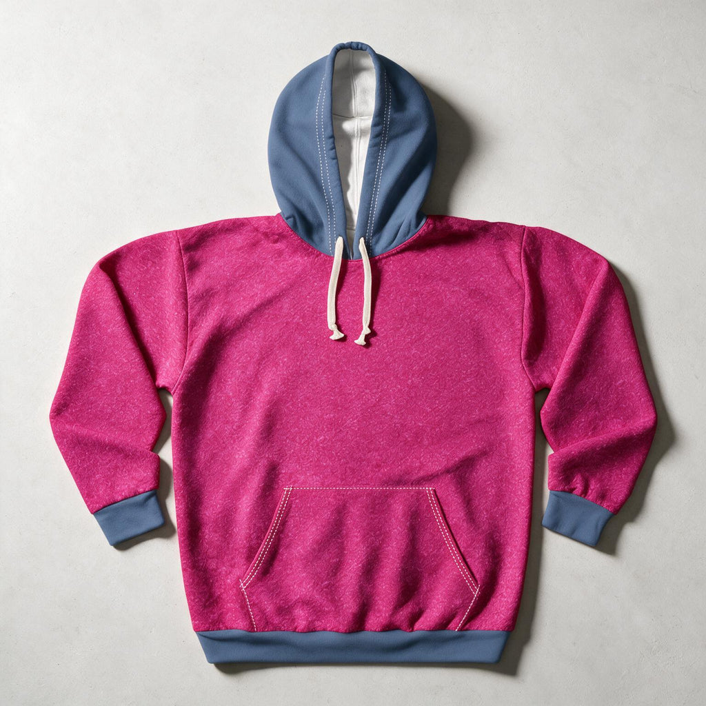 A heather pink pullover hoodie with a contrasting slate blue hood, cuffs, and hem, featuring white drawstrings and a front kangaroo pocket, laid flat on a light gray background.