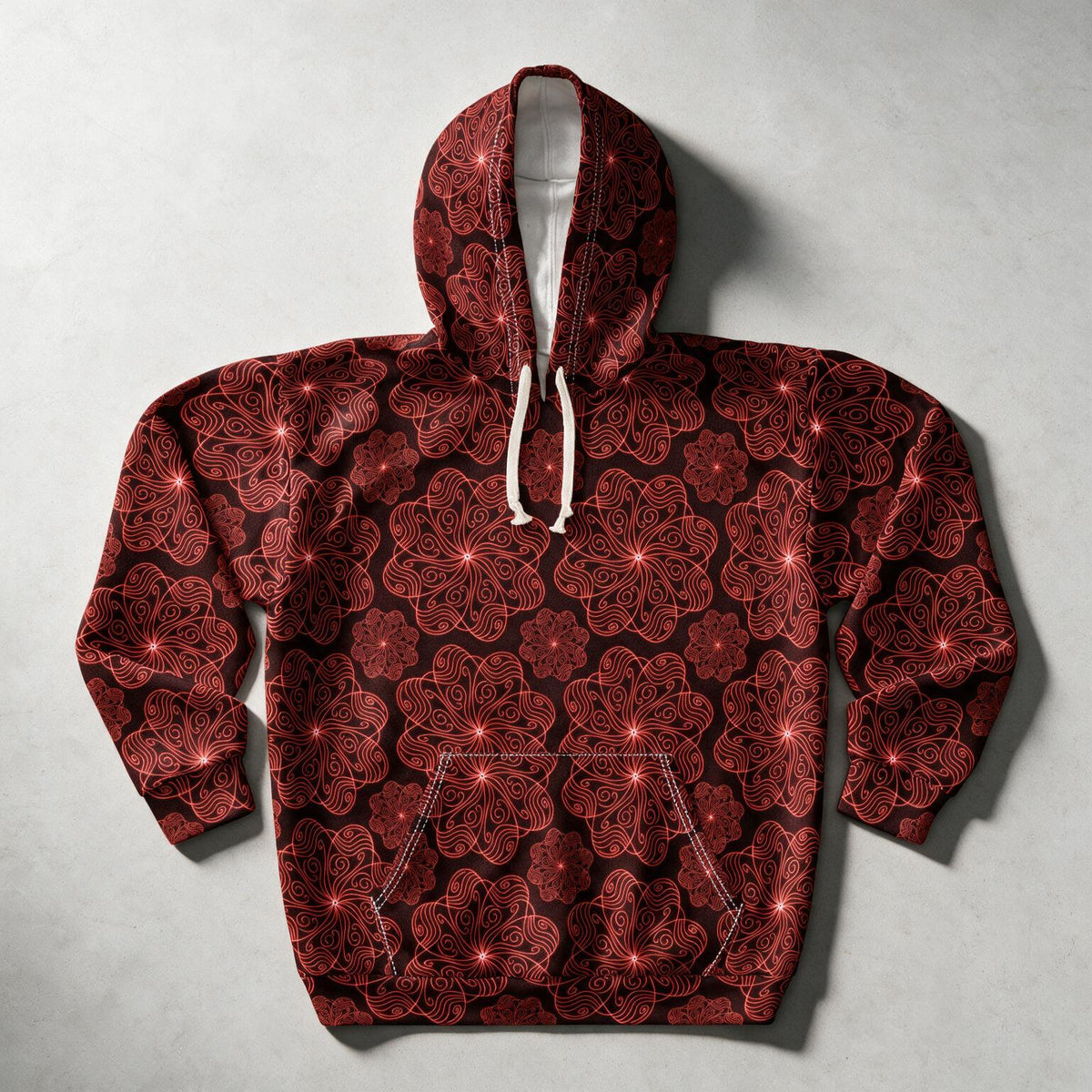 A dark red and black patterned hoodie with white drawstrings, laid flat on a light gray background.